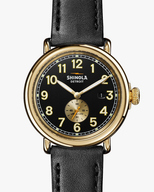 THE RUNWELL AUTOMATIC 45MM BLACK WATCH WITH POLISHED GOLD CASE AND LEATHER STRAP