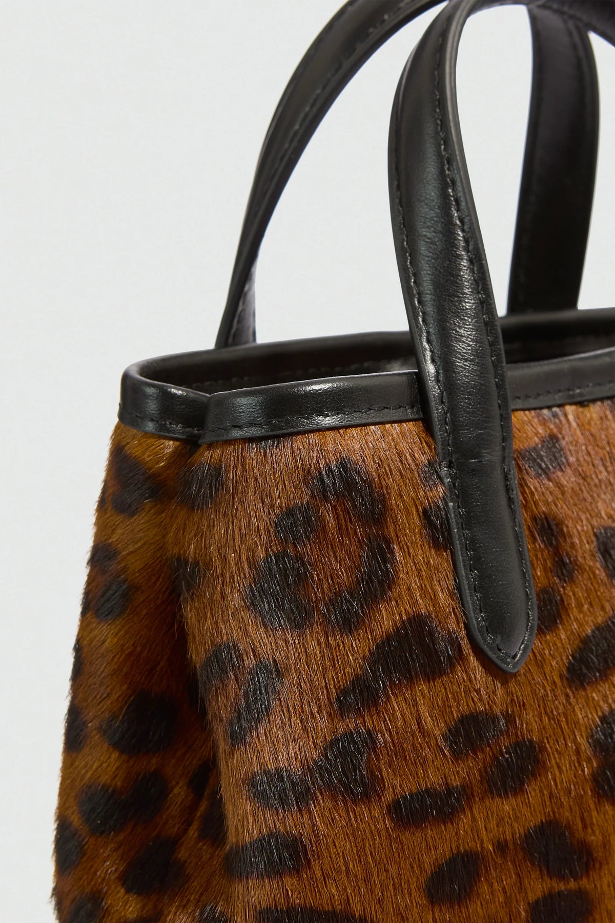ANIMAL PRINT COW HIDE BAG - CAMEL/BLACK SPOTTED